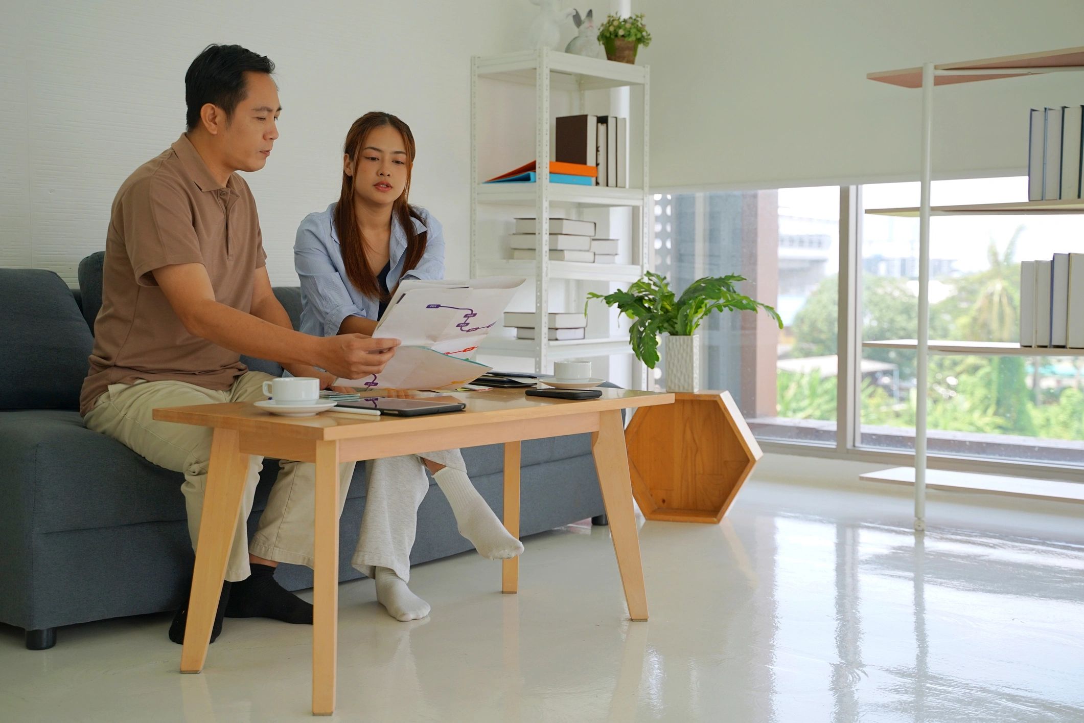 Happy homebuyer couple in a living room